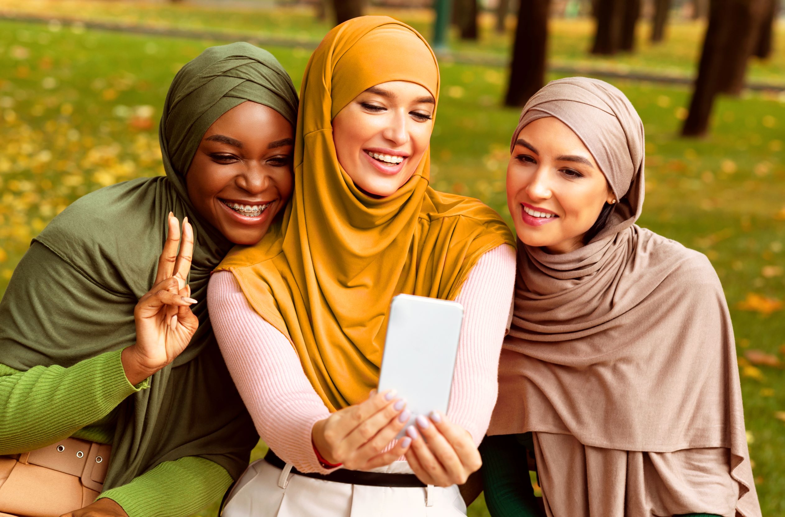 C10 Diverse Trio taking Selfies Diverse Group of Women Taking Selfie